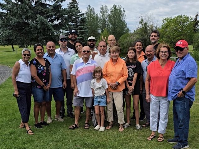 Members and their families gathered on the green at the Stampede Golf & BBQ