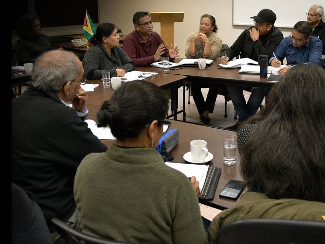 Members around the table at a general meeting